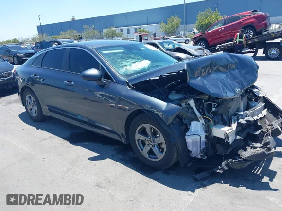 ✅ 2021 Kia K5 LXS • VIN: 5XXG14J20MG016366 • Лот: 42614856. Опубліковано раніше на IAAI з пробігом 103 181 миль. Безкоштовний доступ до архіву аукціонних продажів зі США та докладний звіт про історію автомобіля на DreamBid. Зображення 1.