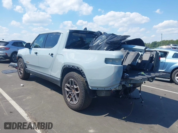 ✅ 2022 Rivian R1T Adventure • VIN: 7FCTGAAA6NN015709 • Lot: 43093648. Wystawiony na IAAI z przebiegiem 22 004 mil. Bezpłatny archiwum sprzedaży aukcyjnych z USA i szczegółowy raport historii pojazdu na DreamBid. Zdjęcie 3.