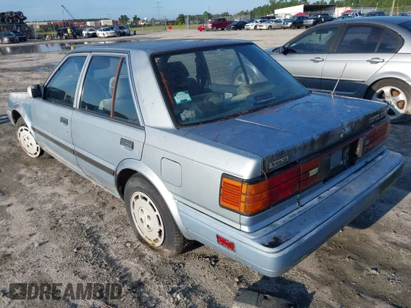 ✅ 1987 Nissan Stanza • VIN: JN1HT21S9HT026289 • Lot: 42987110. Wystawiony na IAAI z przebiegiem 152 508 mil. Bezpłatny archiwum sprzedaży aukcyjnych z USA i szczegółowy raport historii pojazdu na DreamBid. Zdjęcie 3.