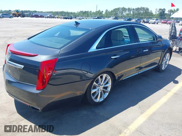 ✅ 2013 Cadillac XTS Premium • VIN: 2G61S5S39D9100602 • Лот: 42171870. Опубликован ранее на IAAI с пробегом 164 016 миль. Бесплатный доступ к архиву аукционных продаж из США и подробный отчёт об истории автомобиля на DreamBid. Изображение 4.