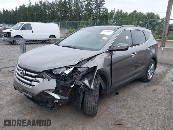✅ 2015 Hyundai Santa Fe • VIN: 5XYZWDLA8FG256018 • Lot: 45202200. Wystawiony na IAAI z przebiegiem 74 125 mil. Bezpłatny archiwum sprzedaży aukcyjnych z USA i szczegółowy raport historii pojazdu na DreamBid. Zdjęcie 2.