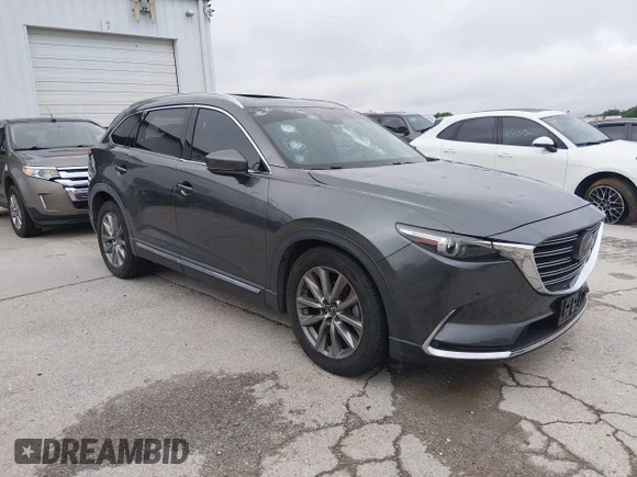 ✅ 2021 Mazda CX-9 Carbon Edition • VIN: JM3TCBDY9M0525264 • Лот: 45168608. Опубликован ранее на IAAI с пробегом 83 567 миль. Бесплатный доступ к архиву аукционных продаж из США и подробный отчёт об истории автомобиля на DreamBid. Изображение 1.