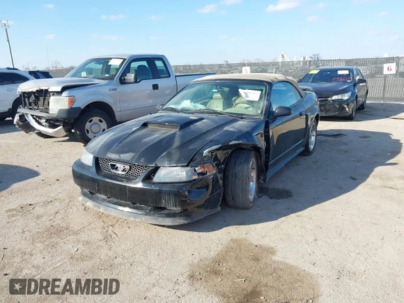 ✅ 2004 Ford Mustang GT Deluxe • VIN: 1FAFP45X64F207701 • Lot: 43985803. Listed on IAAI with 70,587 mi. Free auction sales archive from the USA and detailed vehicle history report at DreamBid. Image 2.
