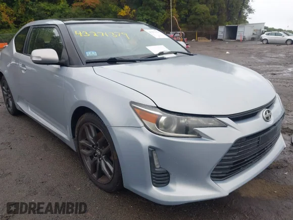 ✅ 2014 Scion tC • VIN: JTKJF5C78E3067100 • Лот: 43271379. Опубліковано раніше на IAAI з пробігом 165 264 миль. Безкоштовний доступ до архіву аукціонних продажів зі США та докладний звіт про історію автомобіля на DreamBid. Зображення 1.