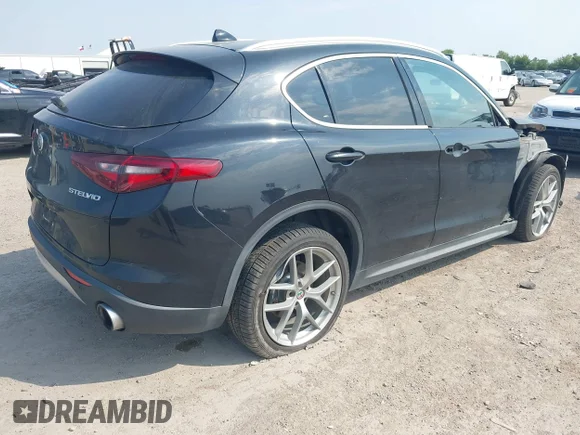 ✅ 2018 Alfa Romeo Stelvio Ti • VIN: ZASFAKBN2J7C02964 • Lot: 43056602. Listed on IAAI with 100,179 mi. Free auction sales archive from the USA and detailed vehicle history report at DreamBid. Image 4.