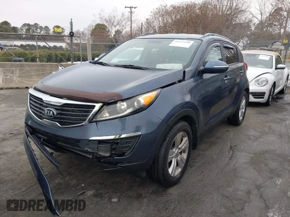 ✅ 2013 Kia Sportage LX • VIN: KNDPB3A25D7490605 • Lot: 44323190. Wystawiony na IAAI z przebiegiem 101 982 mil. Bezpłatny archiwum sprzedaży aukcyjnych z USA i szczegółowy raport historii pojazdu na DreamBid. Zdjęcie 2.