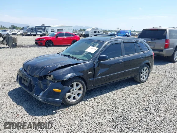 ✅ 2002 Mazda Protege • VIN: JM1BJ245321607725 • Лот: 42852304. Опубліковано раніше на IAAI з пробігом 293 564 миль. Безкоштовний доступ до архіву аукціонних продажів зі США та докладний звіт про історію автомобіля на DreamBid. Зображення 2.