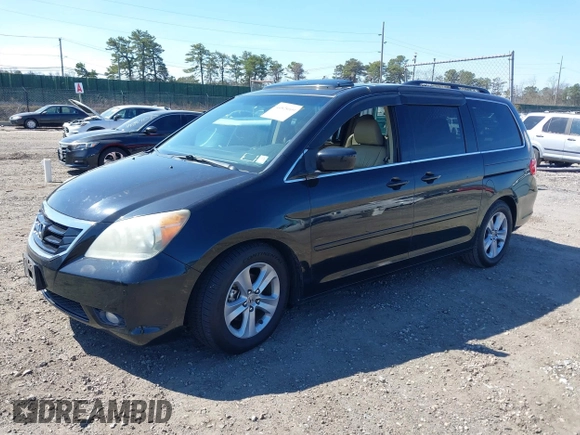 ✅ 2009 Honda Odyssey Touring • VIN: 5FNRL38949B040003 • Lot: 44828009. Wystawiony na IAAI z przebiegiem 144 604 mil. Bezpłatny archiwum sprzedaży aukcyjnych z USA i szczegółowy raport historii pojazdu na DreamBid. Zdjęcie 2.