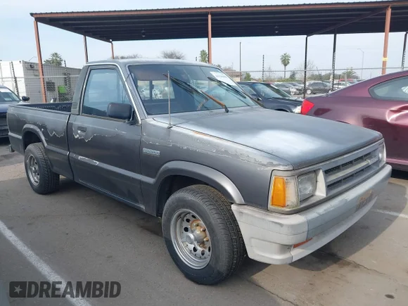 ✅ 1989 Mazda B-Series • VIN: JM2UF1134K0797298 • Лот: 44318408. Опубликован ранее на IAAI с пробегом 86 937 миль. Бесплатный доступ к архиву аукционных продаж из США и подробный отчёт об истории автомобиля на DreamBid. Изображение 1.