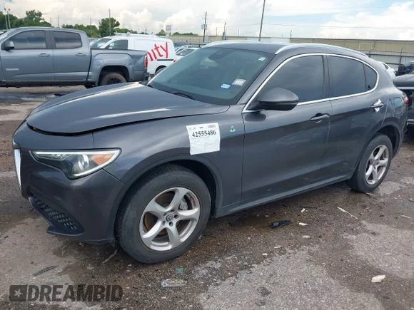 ✅ 2018 Alfa Romeo Stelvio • VIN: ZASFAKANXJ7B74929 • Lot: 42555486. Listed on IAAI with 105,572 mi. Free auction sales archive from the USA and detailed vehicle history report at DreamBid. Image 2.