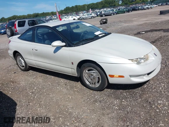 ✅ 1998 Saturn SC • VIN: 1G8ZH1272WZ248927 • Lot: 43002221. Wystawiony na IAAI z przebiegiem 65 686 mil. Bezpłatny archiwum sprzedaży aukcyjnych z USA i szczegółowy raport historii pojazdu na DreamBid. Zdjęcie 1.