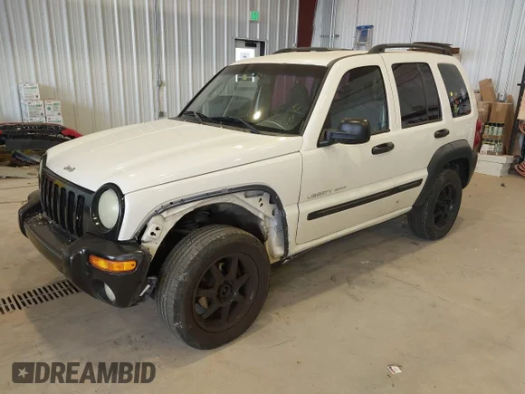 ✅ 2003 Jeep Liberty Sport • VIN: 1J4GL48K73W511462 • Lot: 42388927. Listed on IAAI with 299,215 mi. Free auction sales archive from the USA and detailed vehicle history report at DreamBid. Image 2.