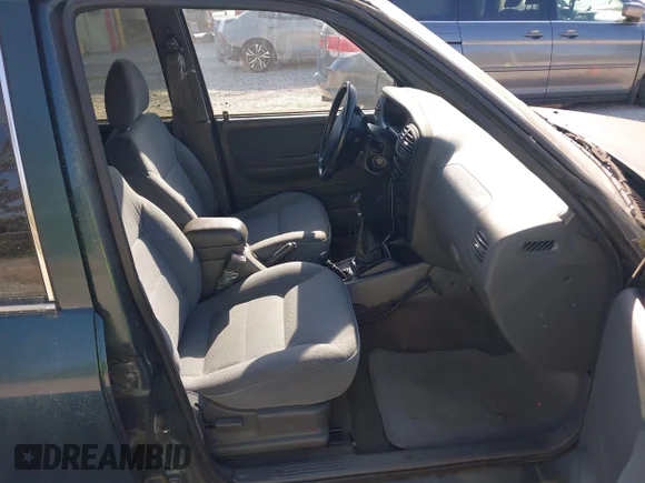 ✅ 2002 Kia Sportage • VIN: KNDJA723425144951 • Lot: 42049262. Wystawiony na IAAI z przebiegiem 149 793 mil. Bezpłatny archiwum sprzedaży aukcyjnych z USA i szczegółowy raport historii pojazdu na DreamBid. Zdjęcie 5.