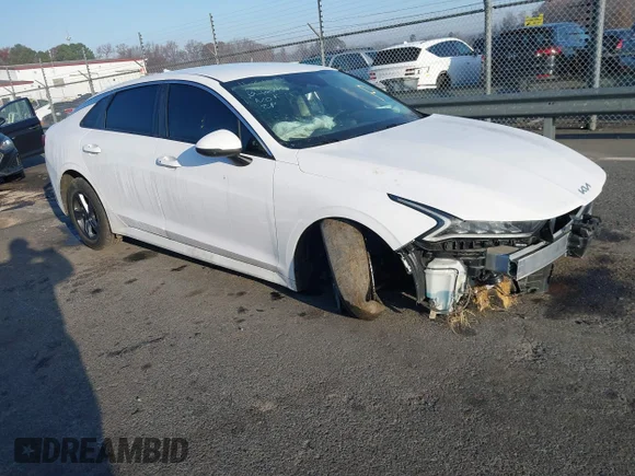 ✅ 2022 Kia K5 LXS • VIN: 5XXG14J23NG100456 • Лот: 41126027. Опубліковано раніше на IAAI з пробігом 129 199 миль. Безкоштовний доступ до архіву аукціонних продажів зі США та докладний звіт про історію автомобіля на DreamBid. Зображення 1.