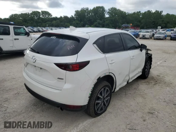 ✅ 2018 Mazda CX-5 Touring • VIN: JM3KFBCM6J0418489 • Lot: 51670502. Wystawiony na Copart z przebiegiem 33 279 mil. Bezpłatny archiwum sprzedaży aukcyjnych z USA i szczegółowy raport historii pojazdu na DreamBid. Zdjęcie 4.