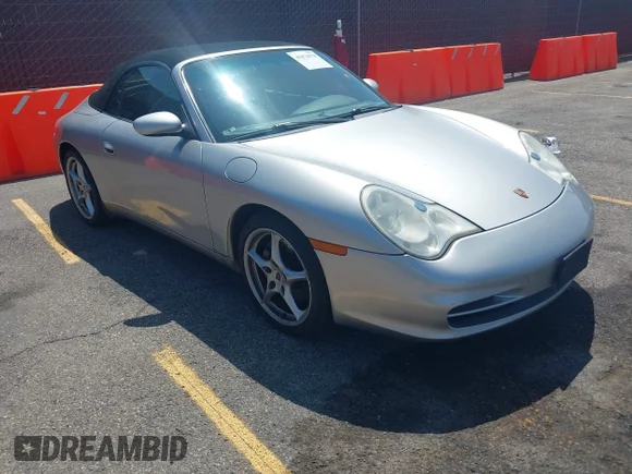 ✅ 2002 Porsche 911 • VIN: WP0CA299X2S652431 • Lot: 45074578. Listed on IAAI with 127,566 mi. Free auction sales archive from the USA and detailed vehicle history report at DreamBid. Image 1.
