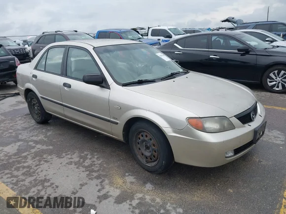 ✅ 2003 Mazda Protege DX • VIN: JM1BJ225030176285 • Lot: 45162663. Listed on IAAI with 109,758 mi. Free auction sales archive from the USA and detailed vehicle history report at DreamBid. Image 1.