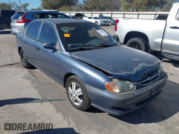 ✅ 2001 Kia Sephia • VIN: KNAFB121415093607 • Lot: 43859778. Listed on IAAI with 124,116 mi. Free auction sales archive from the USA and detailed vehicle history report at DreamBid. Image 1.
