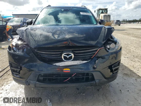 ✅ 2016 Mazda CX-5 Grand Touring • VIN: JM3KE4DY7G0705493 • Lot: 79759244. Wystawiony na Copart z przebiegiem 147 308 mil. Bezpłatny archiwum sprzedaży aukcyjnych z USA i szczegółowy raport historii pojazdu na DreamBid. Zdjęcie 5.