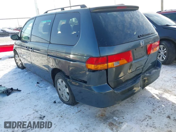 ✅ 2004 Honda Odyssey EX-L • VIN: 5FNRL18944B093717 • Lot: 43791800. Listed on IAAI with 221,179 mi. Free auction sales archive from the USA and detailed vehicle history report at DreamBid. Image 3.