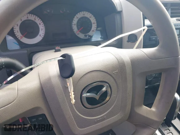 ✅ 2010 Mazda Tribute Sport • VIN: 4F2CY0C75AKM03573 • Лот: 43188636. Опубліковано раніше на IAAI з пробігом 185 368 миль. Безкоштовний доступ до архіву аукціонних продажів зі США та докладний звіт про історію автомобіля на DreamBid. Зображення 11.