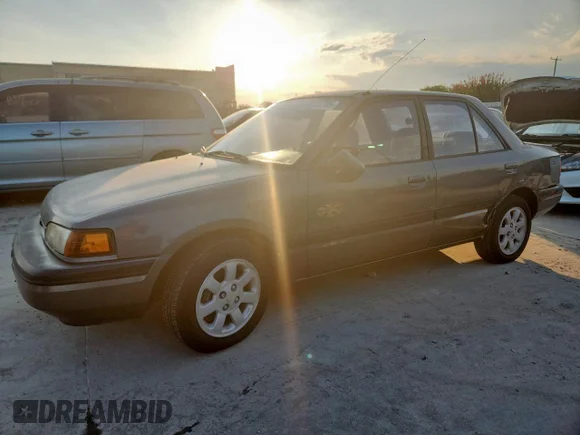 ✅ 1994 Mazda Protege • VIN: JM1BG2265R0782553 • Lot: 69733705. Listed on Copart with 332,290 mi. Free auction sales archive from the USA and detailed vehicle history report at DreamBid. Image 1.