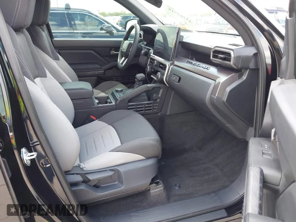 ✅ 2025 Toyota Tacoma SR5 • VIN: 3TMKB5FN3SM031763 • Lot: 43282918. Listed on IAAI with 8,190 mi. Free auction sales archive from the USA and detailed vehicle history report at DreamBid. Image 5.