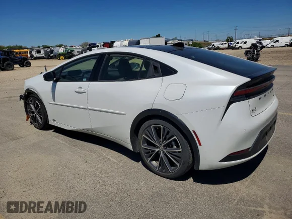 ✅ 2023 Toyota Prius XLE • VIN: JTDADABU9P3001591 • Lot: 52517646. Wystawiony na Copart z przebiegiem 74 082 mil. Bezpłatny archiwum sprzedaży aukcyjnych z USA i szczegółowy raport historii pojazdu na DreamBid. Zdjęcie 2.