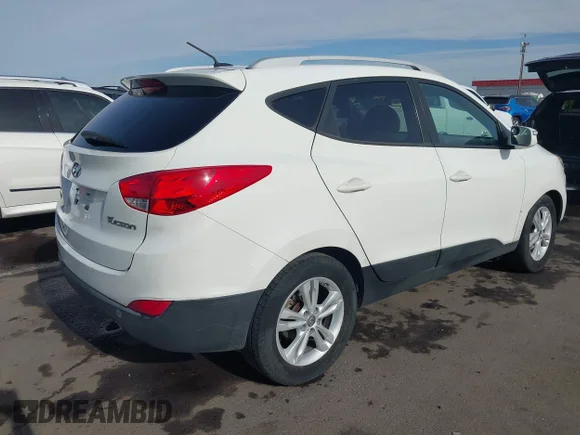 ✅ 2012 Hyundai Tucson Limited • VIN: KM8JU3AC0CU484621 • Lot: 44926226. Listed on IAAI with 241,766 mi. Free auction sales archive from the USA and detailed vehicle history report at DreamBid. Image 4.