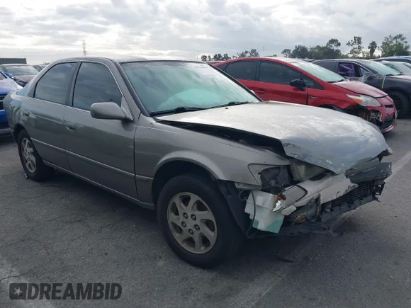 ✅ 1999 Toyota Camry LE • VIN: JT2BF22K8X0157912 • Лот: 43734904. Опубликован ранее на IAAI с пробегом 165 409 миль. Бесплатный доступ к архиву аукционных продаж из США и подробный отчёт об истории автомобиля на DreamBid. Изображение 1.