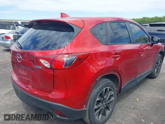 ✅ 2016 Mazda CX-5 Grand Touring • VIN: JM3KE4DY1G0665833 • Лот: 45105216. Опубліковано раніше на IAAI з пробігом 152 162 миль. Безкоштовний доступ до архіву аукціонних продажів зі США та докладний звіт про історію автомобіля на DreamBid. Зображення 4.