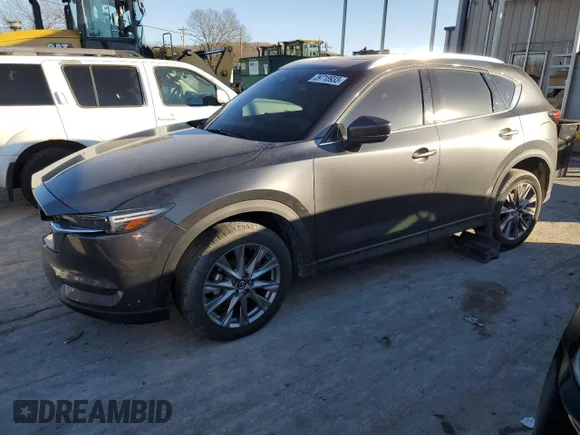 ✅ 2021 Mazda CX-5 Grand Touring • VIN: JM3KFADM7M0469853 • Lot: 39718933. Wystawiony na Copart z przebiegiem 23 062 mil. Bezpłatny archiwum sprzedaży aukcyjnych z USA i szczegółowy raport historii pojazdu na DreamBid. Zdjęcie 1.