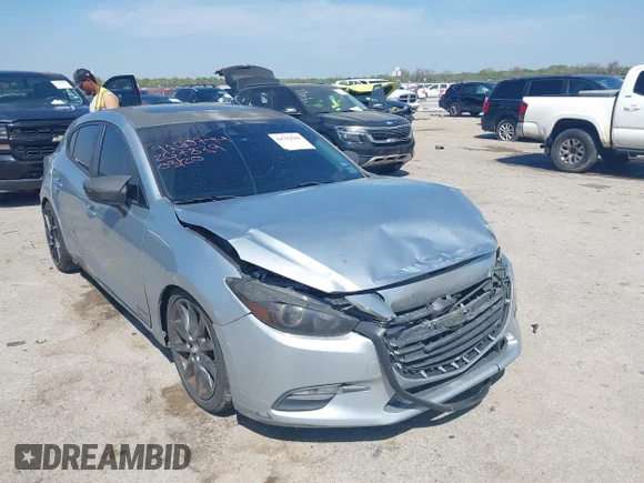 ✅ 2018 Mazda 3 Touring • VIN: 3MZBN1L38JM267839 • Lot: 44702506. Listed on IAAI with 104,863 mi. Free auction sales archive from the USA and detailed vehicle history report at DreamBid. Image 1.
