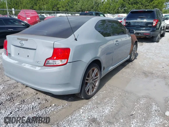 ✅ 2011 Scion tC • VIN: JTKJF5C75B3004726 • Lot: 42466256. Wystawiony na IAAI z przebiegiem 163 355 mil. Bezpłatny archiwum sprzedaży aukcyjnych z USA i szczegółowy raport historii pojazdu na DreamBid. Zdjęcie 4.