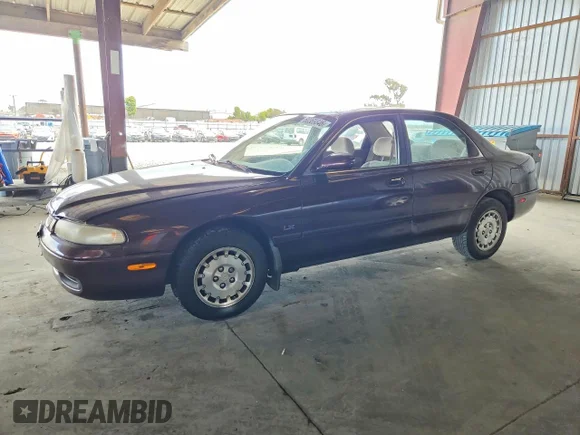 ✅ 1996 Mazda 626 DX • VIN: 1YVGE22C6T5562747 • Lot: 60369846. Listed on Copart with 62,498 mi. Free auction sales archive from the USA and detailed vehicle history report at DreamBid. Image 1.