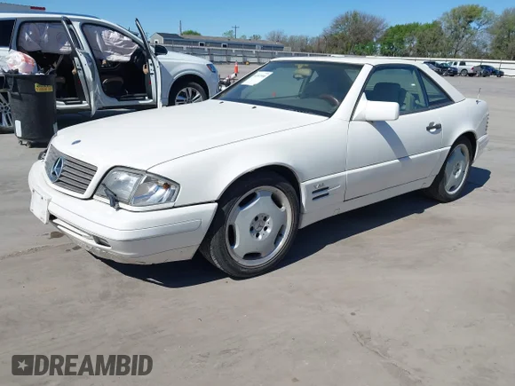 ✅ 1996 Mercedes-Benz SL 500 • VIN: WDBFA67FXTF129741 • Лот: 44597590. Опубліковано раніше на IAAI з пробігом 170 916 миль. Безкоштовний доступ до архіву аукціонних продажів зі США та докладний звіт про історію автомобіля на DreamBid. Зображення 2.