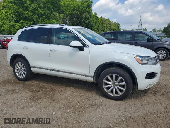 ✅ 2014 Volkswagen Touareg Sport • VIN: WVGEF9BP3ED006728 • Lot: 57782256. Listed on Copart with 236,115 km. Free auction sales archive from the USA and detailed vehicle history report at DreamBid. Image 4.