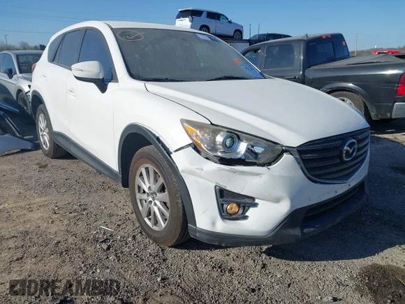 ✅ 2016 Mazda CX-5 Touring • VIN: JM3KE2CY8G0827009 • Lot: 44713498. Wystawiony na IAAI z przebiegiem 160 703 mil. Bezpłatny archiwum sprzedaży aukcyjnych z USA i szczegółowy raport historii pojazdu na DreamBid. Zdjęcie 1.