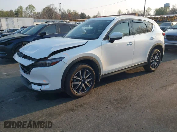 ✅ 2018 Mazda CX-5 Grand Touring • VIN: JM3KFADM4J1425329 • Лот: 44710470. Опубліковано раніше на IAAI з пробігом 73 476 миль. Безкоштовний доступ до архіву аукціонних продажів зі США та докладний звіт про історію автомобіля на DreamBid. Зображення 2.