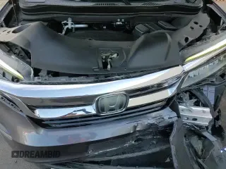 ✅ 2020 Honda Pilot Touring 8-Passenger • VIN: 5FNYF5H90LB012334 • Лот: 71932925. Опубликован ранее на Copart с пробегом 57 247 миль. Бесплатный доступ к архиву аукционных продаж из США и подробный отчёт об истории автомобиля на DreamBid. Изображение 13.