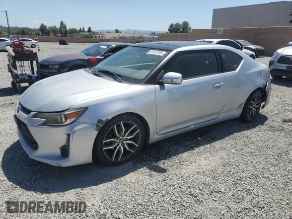 ✅ 2014 Scion tC • VIN: JTKJF5C7XE3079605 • Lot: 57472705. Listed on Copart with 149,625 mi. Free auction sales archive from the USA and detailed vehicle history report at DreamBid. Image 1.