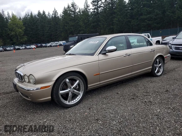 ✅ 2005 Jaguar XJ Vanden Plas • VIN: SAJWA82C65SG42882 • Lot: 67870935. Listed on Copart with 114,201 mi. Free auction sales archive from the USA and detailed vehicle history report at DreamBid. Image 1.