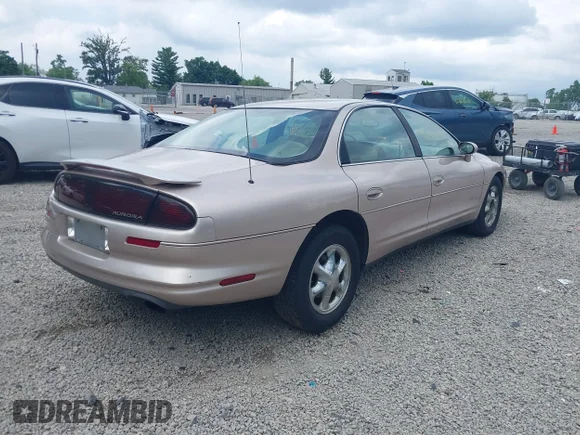 ✅ 1998 Oldsmobile Aurora • VIN: 1G3GR62CXW4121053 • Лот: 42681188. Опубліковано раніше на IAAI з пробігом 99 160 миль. Безкоштовний доступ до архіву аукціонних продажів зі США та докладний звіт про історію автомобіля на DreamBid. Зображення 4.
