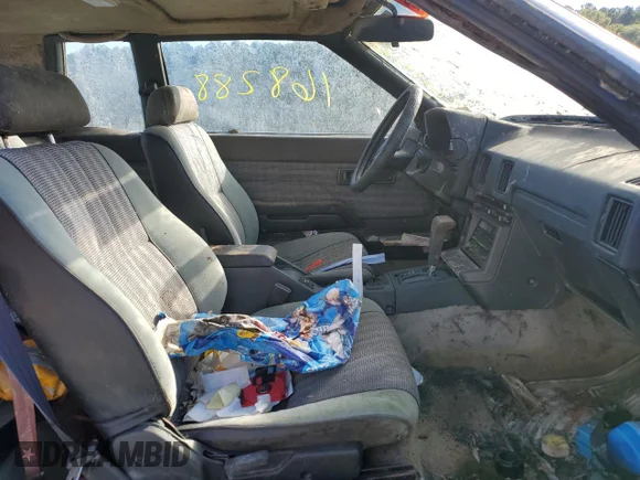 ✅ 1984 Toyota Celica • VIN: JT2RA64C7E6218560 • Lot: 63087872. Wystawiony na Copart z przebiegiem 168 288 mil. Bezpłatny archiwum sprzedaży aukcyjnych z USA i szczegółowy raport historii pojazdu na DreamBid. Zdjęcie 5.