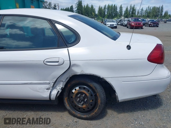 ✅ 2001 Ford Taurus SES Standard • VIN: 1FAFP55211G242999 • Лот: 42499191. Опубликован ранее на IAAI с пробегом 165 627 миль. Бесплатный доступ к архиву аукционных продаж из США и подробный отчёт об истории автомобиля на DreamBid. Изображение 6.