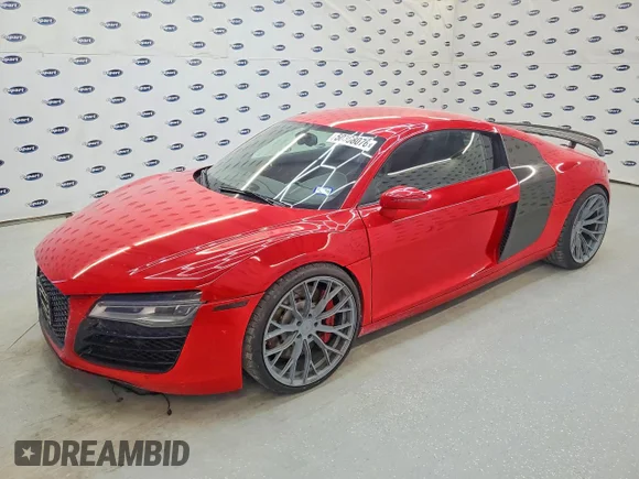 ✅ 2015 Audi R8 • VIN: WUAAUAFG1F7000899 • Лот: 50308076. Опубликован ранее на Copart с пробегом 82 768 миль. Бесплатный доступ к архиву аукционных продаж из США и подробный отчёт об истории автомобиля на DreamBid. Изображение 1.