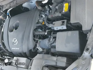 ✅ 2025 Mazda CX-5 S • VIN: JM3KFBAL2S0558583 • Лот: 43338689. Опубликован ранее на IAAI с пробегом 10 221 миль. Бесплатный доступ к архиву аукционных продаж из США и подробный отчёт об истории автомобиля на DreamBid. Изображение 19.