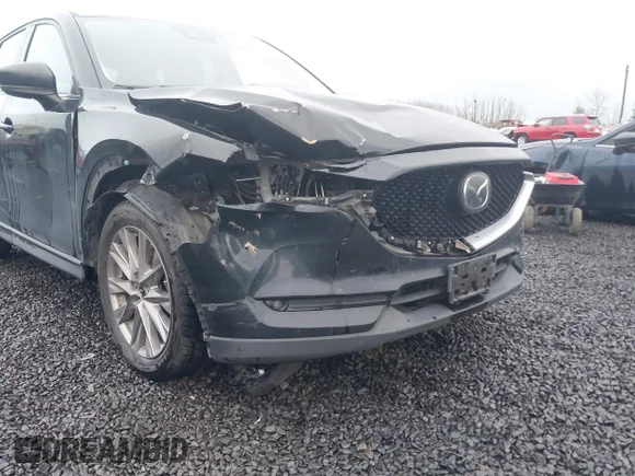 ✅ 2019 Mazda CX-5 Grand Touring • VIN: JM3KFBDM0K0518796 • Lot: 44074488. Wystawiony na IAAI z przebiegiem 61 815 mil. Bezpłatny archiwum sprzedaży aukcyjnych z USA i szczegółowy raport historii pojazdu na DreamBid. Zdjęcie 6.