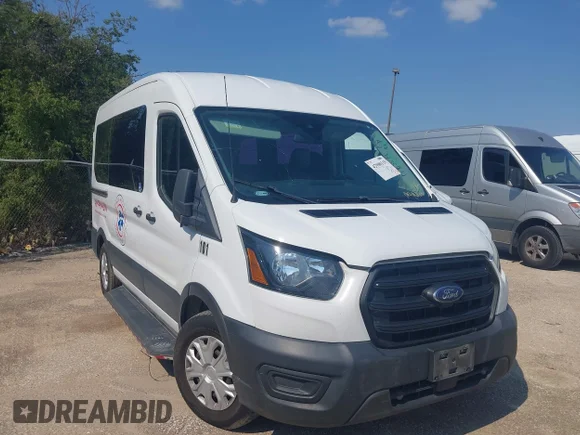 ✅ 2020 Ford Transit Cargo • VIN: 1FTYE1C82LKA63573 • Lot: 42900119. Listed on IAAI with 218,177 mi. Free auction sales archive from the USA and detailed vehicle history report at DreamBid. Image 1.