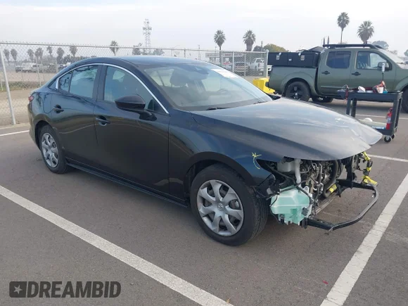 ✅ 2020 Mazda 3 • VIN: 3MZBPABLXLM135440 • Lot: 44331640. Listed on IAAI with 64,250 mi. Free auction sales archive from the USA and detailed vehicle history report at DreamBid. Image 1.